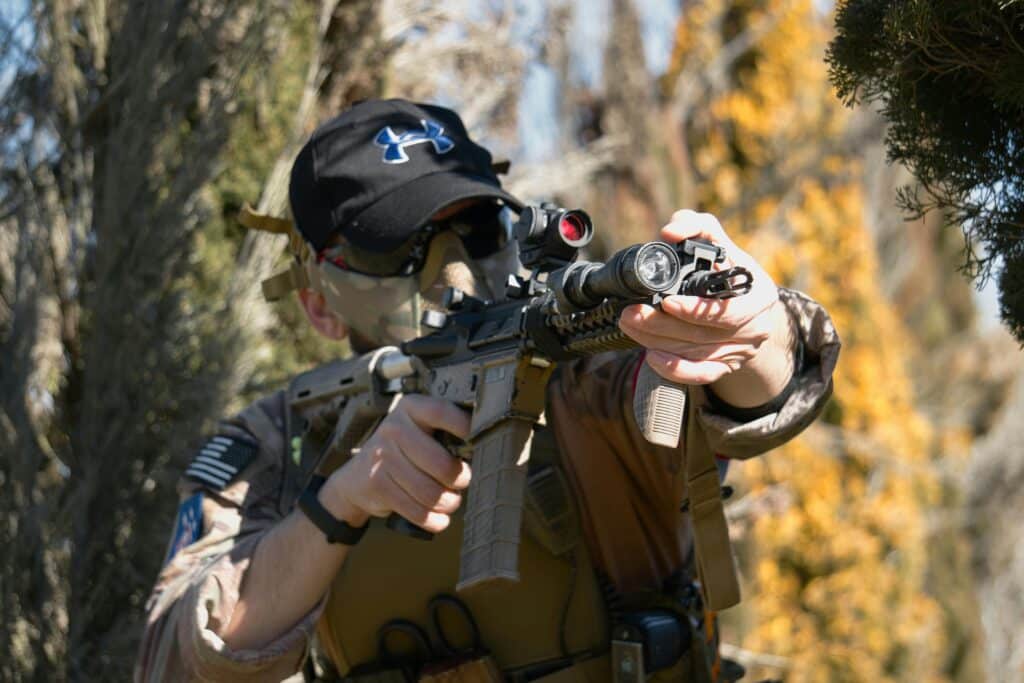 man holding a gel blaster rifle