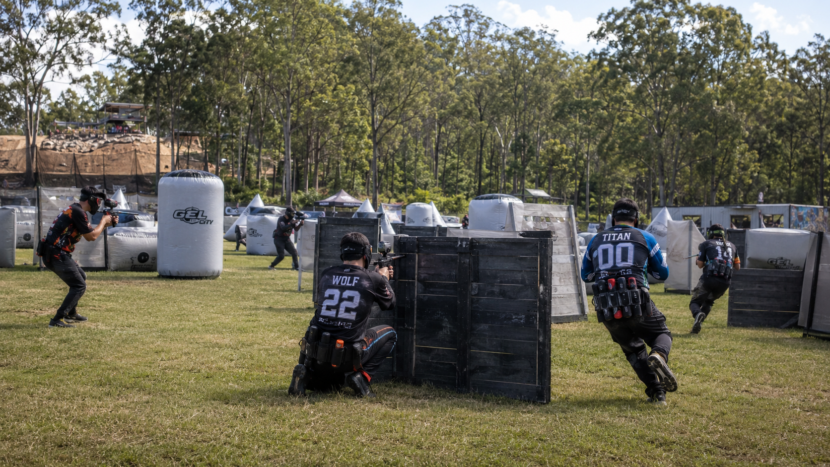 Gel blaster players competing on an outdoor tactical field in Queensland.